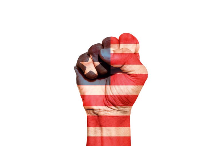 Man hand fist of Liberia flag painted, fist flag, Strength, Power, Protest concept.
