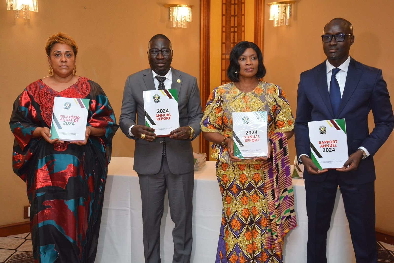 Harris and staff displaying GIABA Annual Report for 2024