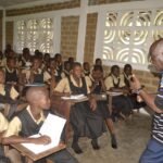 Bishop Dr. Leo M. Simpson inspiring the kids in the classroom