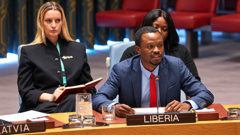 Liberia Delegate at Conference Table
